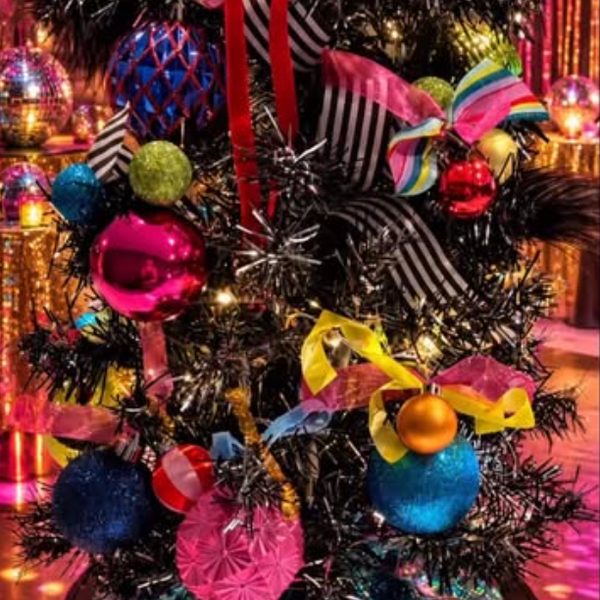 Dopamine Christmas tree styled with bright ornaments and fringe
